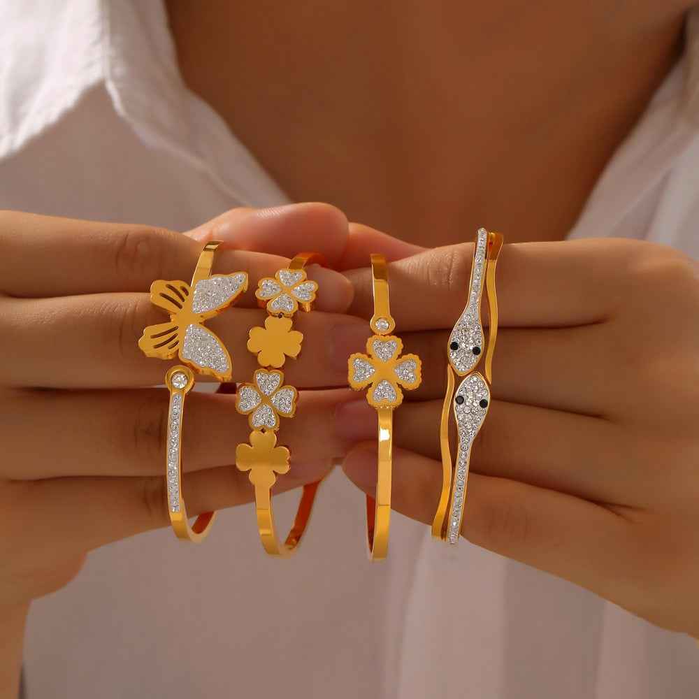 18K Gold Butterfly, Snake & Four-Leaf Clover Diamond Bracelet